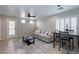 Bright living area with stylish furnishings, a ceiling fan and dining area beyond at 9100 Balcony Trellis Ave, Las Vegas, NV 89149