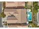 An overhead shot captures the sparkling pool and spa in the backyard and shows the nearby landscaping at 940 Viscanio Pl, Las Vegas, NV 89138