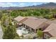 Stunning backyard showcasing a modern pool, patio space, and lush greenery perfect for relaxing and entertaining at 940 Viscanio Pl, Las Vegas, NV 89138