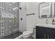 Updated bathroom boasts designer tile in the glass enclosed shower and sleek vanity at 940 Viscanio Pl, Las Vegas, NV 89138