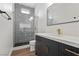 Bathroom featuring a glass-enclosed shower with designer tile and modern vanity at 940 Viscanio Pl, Las Vegas, NV 89138