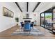 Elegant dining area with stylish decor, a fireplace, and sliding glass doors to the outdoor space at 940 Viscanio Pl, Las Vegas, NV 89138