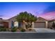 Charming single-story home with desert landscaping and a two-car garage, perfect for comfortable living at 940 Viscanio Pl, Las Vegas, NV 89138