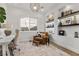 Stylish home office with built-in shelves and a comfortable chair at 940 Viscanio Pl, Las Vegas, NV 89138