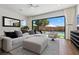 Cozy living room with large sliding glass doors opening up to a private backyard and pool at 940 Viscanio Pl, Las Vegas, NV 89138