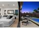 Open concept living room with sliding glass doors offering access to pool and backyard at 940 Viscanio Pl, Las Vegas, NV 89138