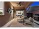 Cozy covered patio with plush outdoor seating and dining, plus backyard and desert landscape views at 940 Viscanio Pl, Las Vegas, NV 89138