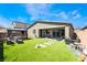 Expansive backyard featuring artificial turf, a gazebo, and a patio area for outdoor enjoyment at 9565 Camelback Creek Dr, Las Vegas, NV 89178