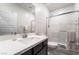 Well-lit bathroom with modern vanity, shower with glass door and white subway tile surround at 9565 Camelback Creek Dr, Las Vegas, NV 89178