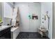 This is a bathroom featuring a sleek, tiled shower with a rainfall shower head and modern fixtures at 9565 Camelback Creek Dr, Las Vegas, NV 89178