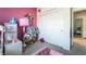 This is a bedroom featuring a playful decor, closet, and pink wall at 9565 Camelback Creek Dr, Las Vegas, NV 89178
