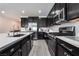 Well-equipped kitchen boasting an island, stainless steel appliances, and ample countertop space, perfect for culinary enthusiasts at 9565 Camelback Creek Dr, Las Vegas, NV 89178