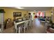 Spacious living room with dining area, neutral tile flooring, and bright natural light at , Las Vegas, NV 89121