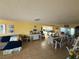 Open-concept living space with tile floors, a dining area, and a view into the bright, updated kitchen at , Las Vegas, NV 89121
