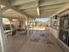 Covered patio with ample seating, view of landscaped backyard at , Las Vegas, NV 89121