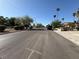 Wide street view showing the neighborhood with mature trees, well-maintained landscaping, and clear blue skies at , Las Vegas, NV 89121