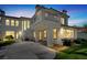 Backyard features a wrought iron balcony, outdoor dining area, and well-maintained lawn, perfect for entertaining at , Las Vegas, NV 89135