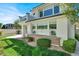 Lush backyard featuring an upper balcony, a comfortable seating area, and a manicured lawn at , Las Vegas, NV 89135