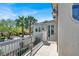 Balcony view of palm trees, bright blue skies, and a well maintained yard at , Las Vegas, NV 89135