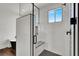 Luxurious bathroom showcasing a glass-enclosed shower with bench and modern fixtures at , Las Vegas, NV 89135