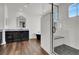 Luxurious bathroom with black and white tiles, glass enclosed shower, and modern vanity at , Las Vegas, NV 89135