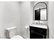 Elegant bathroom featuring a marble countertop, black vanity, and stylish mirror at , Las Vegas, NV 89135