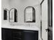 Charming bathroom with elegant, arched mirrors and a double sink vanity with marble counters at , Las Vegas, NV 89135