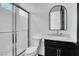 Bathroom featuring a glass enclosed shower and dark cabinets with marble countertops at , Las Vegas, NV 89135