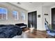 Cozy bedroom with natural light from windows offering scenic mountain views and dark closet doors at , Las Vegas, NV 89135