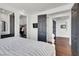 Well-lit bedroom featuring hardwood floors, and many doors leading to the closet and bathroom at , Las Vegas, NV 89135