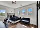 Bright bedroom featuring wood floors, a fluffy throw, and a view of the surrounding mountains at , Las Vegas, NV 89135