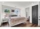 Bright bedroom with hardwood floors, a double bed, and an ensuite bathroom at , Las Vegas, NV 89135