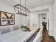 Dining area featuring a long table, modern light fixture, and a wine refrigerator at , Las Vegas, NV 89135