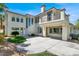 Beautiful two-story home featuring stucco siding, a balcony, multiple windows, concrete patio and professionally landscaped yard at , Las Vegas, NV 89135
