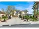 Elegant two-story home featuring a well-manicured front yard, desert landscaping and a two-car garage at , Las Vegas, NV 89135