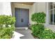 Inviting entryway with double doors, lush greenery, exterior lanterns and a tiled walkway at , Las Vegas, NV 89135