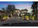 Stately two-story home with a landscaped yard, driveway, and lush, mature landscaping at , Las Vegas, NV 89135