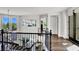 Bright hallway with staircase, modern railing, and view of the neighborhood at , Las Vegas, NV 89135