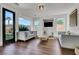 Bright living room featuring two sofas, dark wood floors, and ample natural light at , Las Vegas, NV 89135