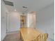 Dining space featuring a wood table and chairs, connecting to adjacent rooms at 1004 Huckburn Ave, Henderson, NV 89015