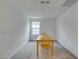 Dining area with table and chairs, bathed in natural light from nearby window at 1004 Huckburn Ave, Henderson, NV 89015
