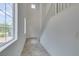 Bright entryway with tile flooring, high ceilings, a staircase and large windows at 1004 Huckburn Ave, Henderson, NV 89015