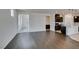 Open concept living room showcasing hardwood floors connecting to the open kitchen area at 1004 Huckburn Ave, Henderson, NV 89015