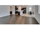 Spacious living room flowing into an open kitchen and dining area perfect for Gathering gatherings at 1004 Huckburn Ave, Henderson, NV 89015
