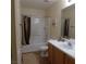 Functional bathroom featuring a shower-tub combo and a single sink vanity at 10360 Lettuce Leaf St, Las Vegas, NV 89183