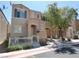 Inviting townhome with a charming front porch and well-maintained landscaping at 10360 Lettuce Leaf St, Las Vegas, NV 89183