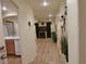 Bright hallway featuring stylish light fixtures and an open view to the living area at 10360 Lettuce Leaf St, Las Vegas, NV 89183