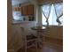 Charming breakfast nook with a round table and natural light from the window at 10360 Lettuce Leaf St, Las Vegas, NV 89183