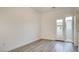 This room features a door with a balcony view and sleek gray wood flooring at 11485 Vibrant Heights Dr # 32, Las Vegas, NV 89135