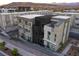 Modern apartment buildings showcase neutral and black facades with balconies and sleek design features at 11485 Vibrant Heights Dr # 32, Las Vegas, NV 89135